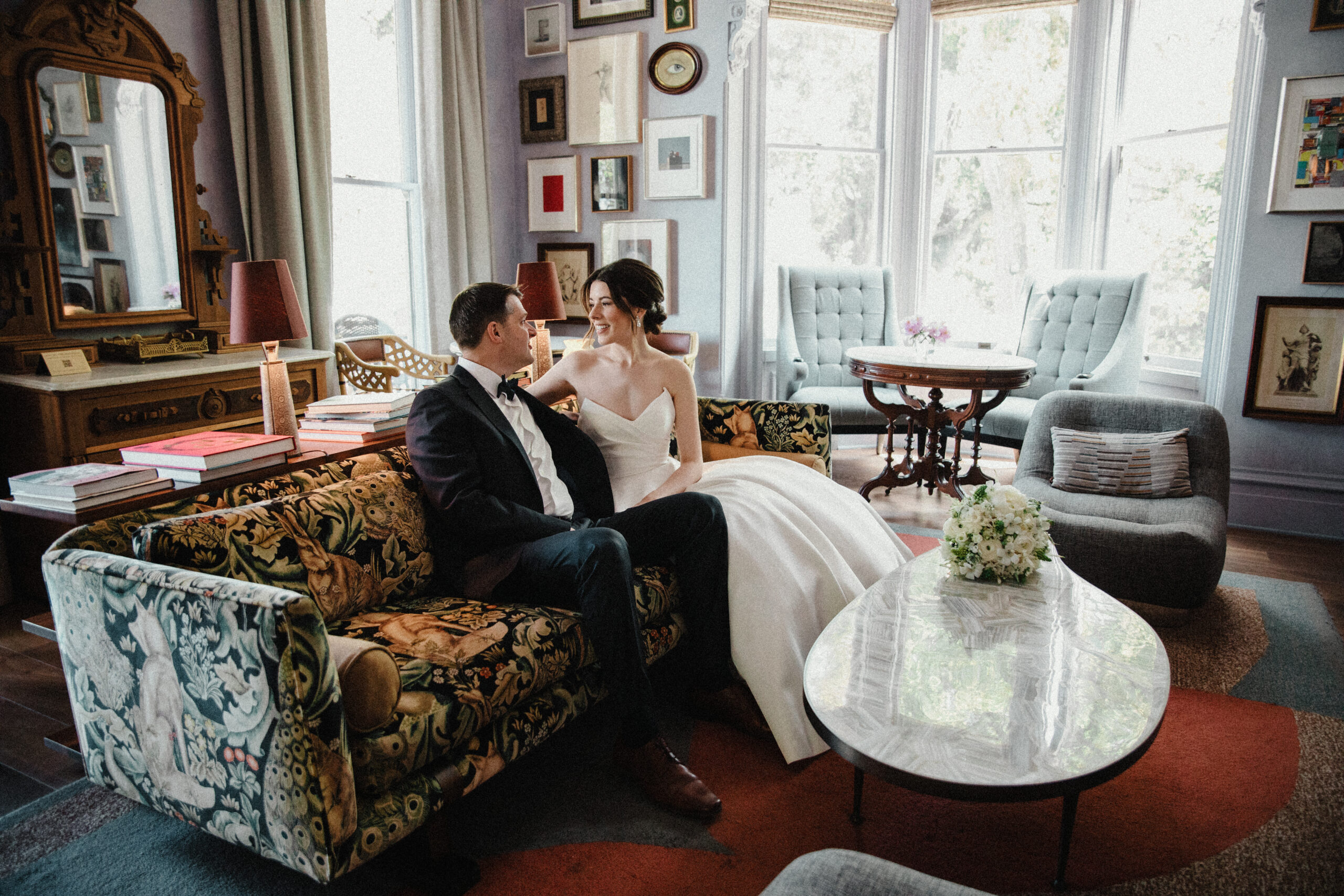 bride and groom sitting in the lounge of the madrona hotel in healdsburg ca