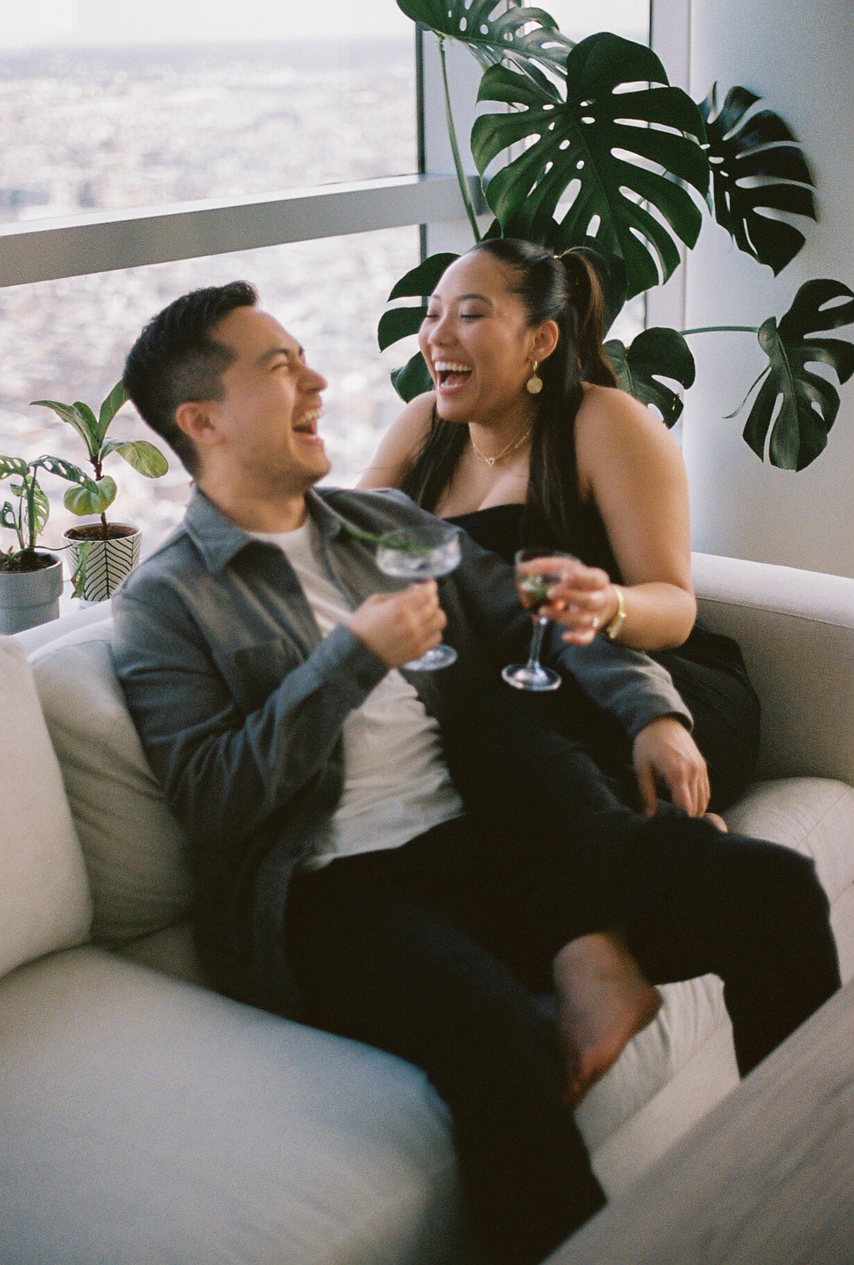 film engagement photo of couple in their apartment in Philadelphia